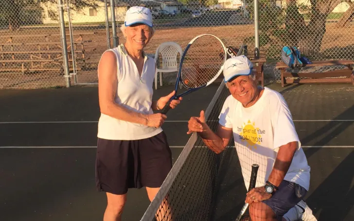 Mike and Carol Porter Gabbard posing after a game of tennis.